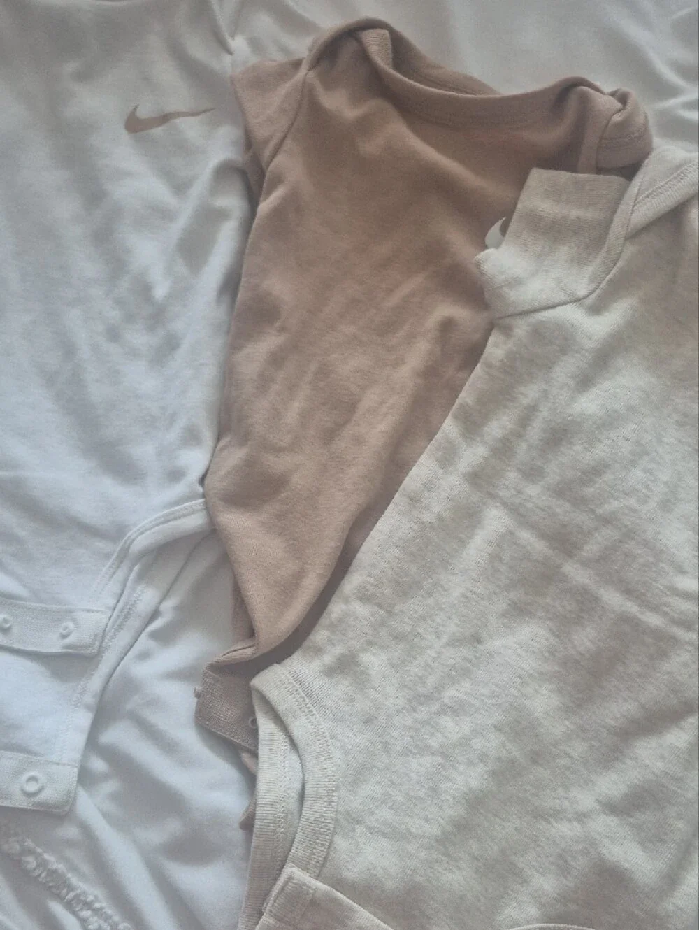 Nike Kids One-Piece Bodysuits in White, Beige, and Tan - Trio Pack